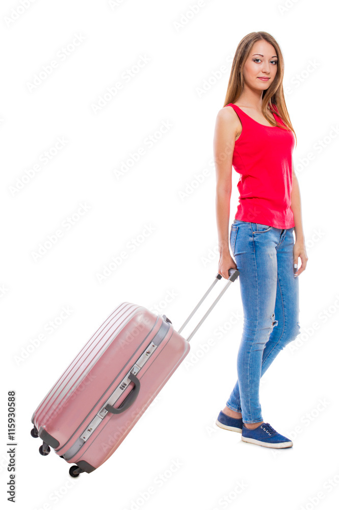Young attractive woman in blue jeans with a suitcase isolated on white background. Young attractive woman in blue jeans with a suitcase isolated on white background.