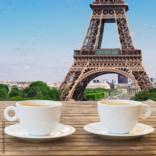 two cups of coffee in Paris cafe with view of Eiffel Tower
