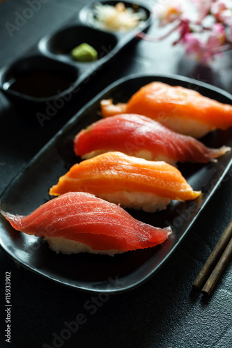 Salmon and tuna sushi with chopsticks