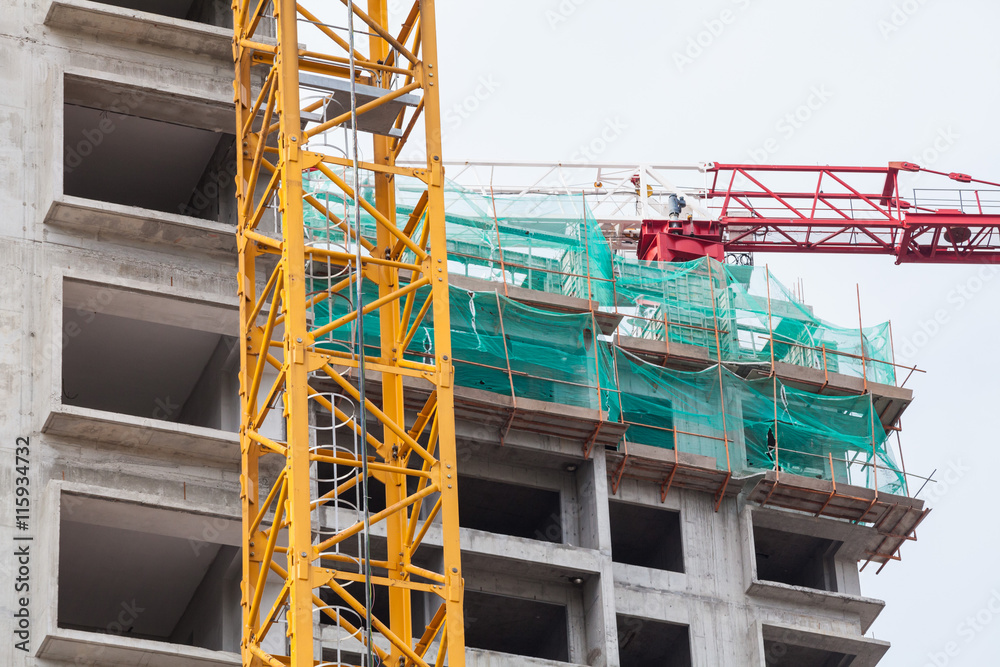 The technology or art of high rise apartment construction using crane, lift, metal beam, brick, metal ladder and concrete in construction site. The technology or art of high rise apartment construction using crane, lift, metal beam, brick, metal ladder and concrete in construction site.
