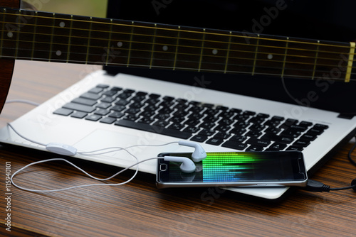 Guitar, put on a headset phone. And on Notebook photo