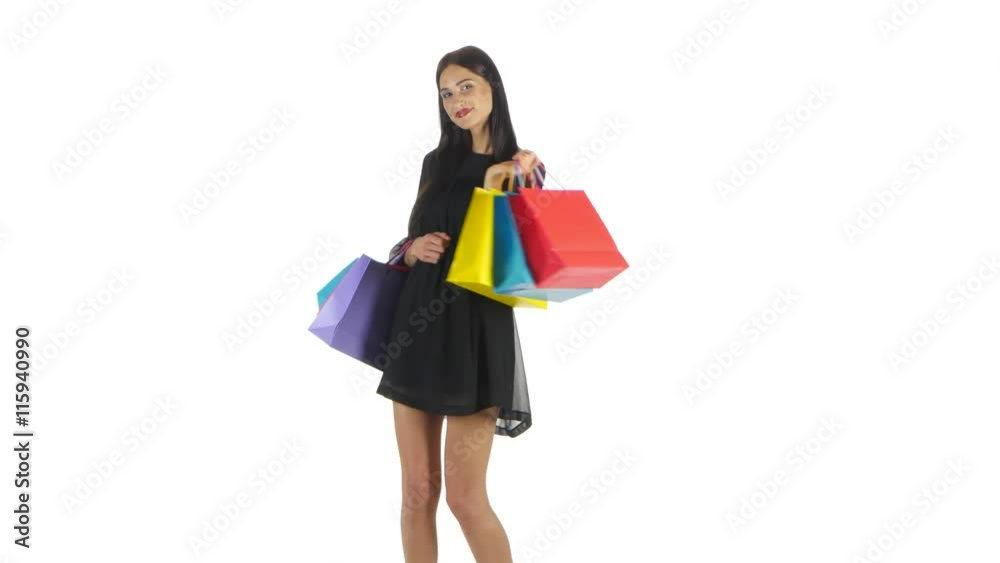 Shopping woman holding shopping bags. White Shopping woman holding shopping bags. White