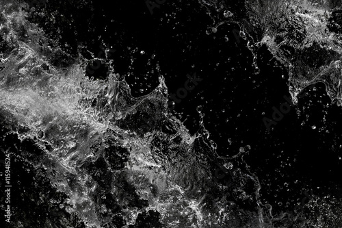 Water splash, isolated on black background © hideto111
