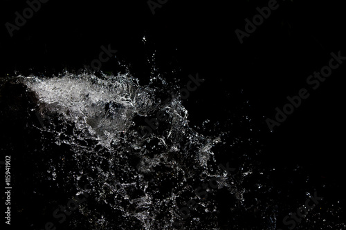 beautiful background with splashes of water on a black backgroun