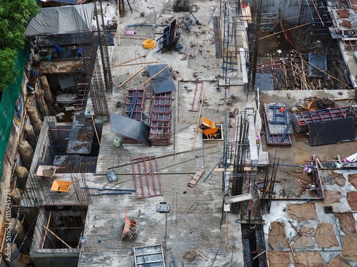 Unsafety Construction Site. The worker is working in construction site without proper safety equipment.
