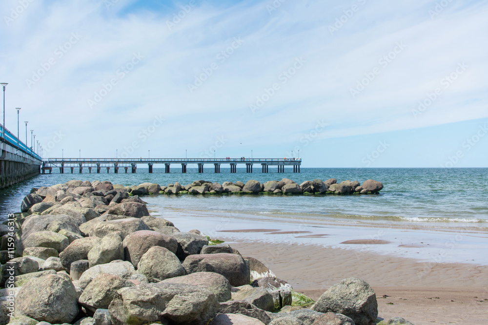 Rocks and dock of Palanga beach in Lithuania