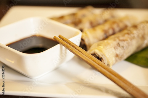 Fried Spring Rolls on the white plate and Soya souse