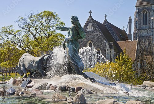 Copenhagen, Denmark - Gefion Fountain  from 1908 the largest fountain of Copenhagen and Saint Alban English Church photo