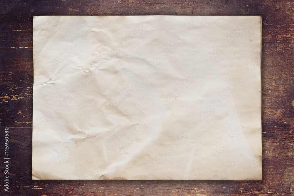 old paper on wood background with space