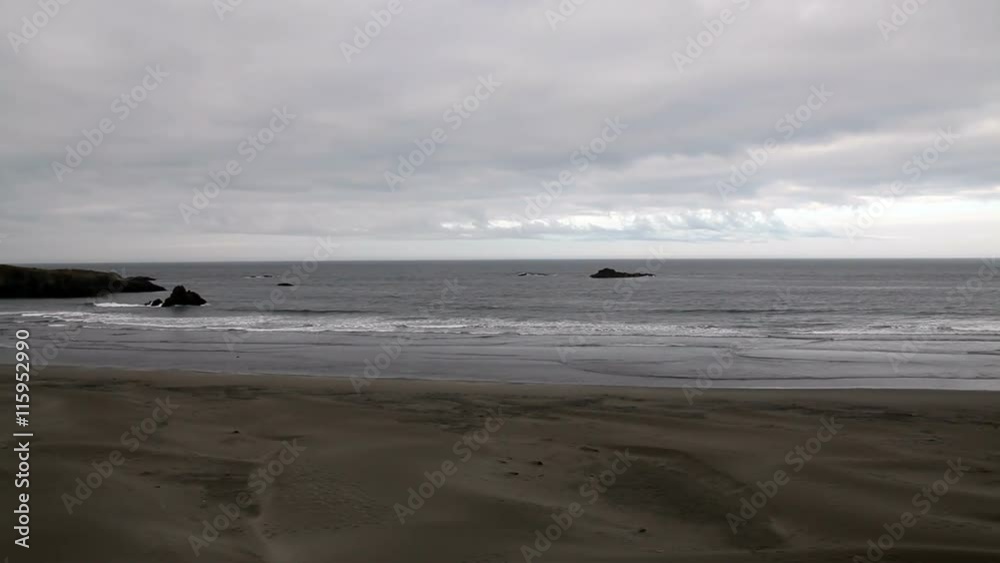 Sand Beach With Ocean Waves Rocks And Overcast Sky
Sand Beach With Ocean Waves Rocks And Overcast Sky