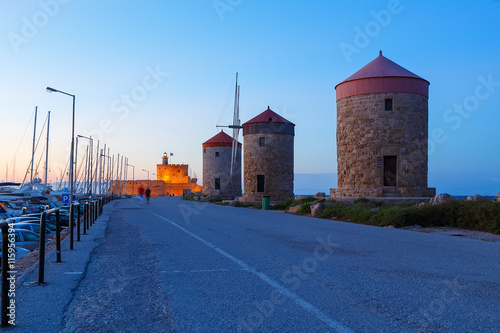 The famous windmills at Mandraki Harbour, Rhodes Greece photo