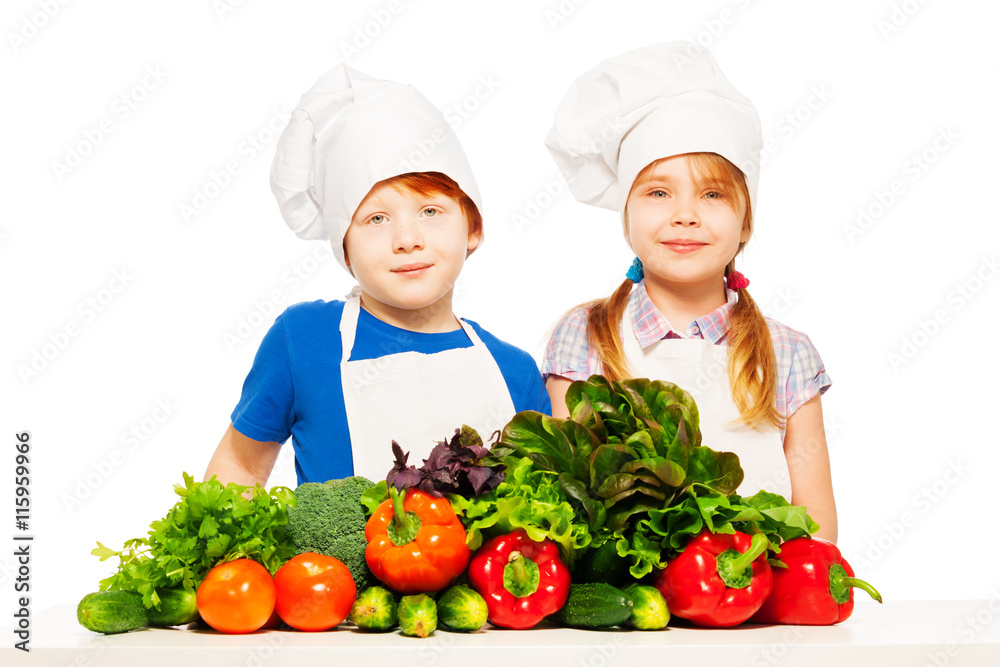 Happy young cooks with fresh vegetables Happy young cooks with fresh vegetables