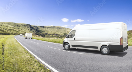 Multiple mini vans in motion on a colorful background