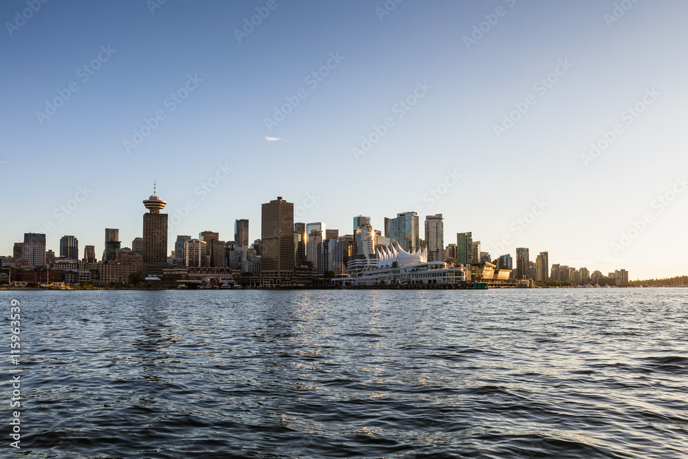 Vancouver Downtown, BC, Canada, City Skyline. Picture taken from water during sunset. Vancouver Downtown, BC, Canada, City Skyline. Picture taken from water during sunset.