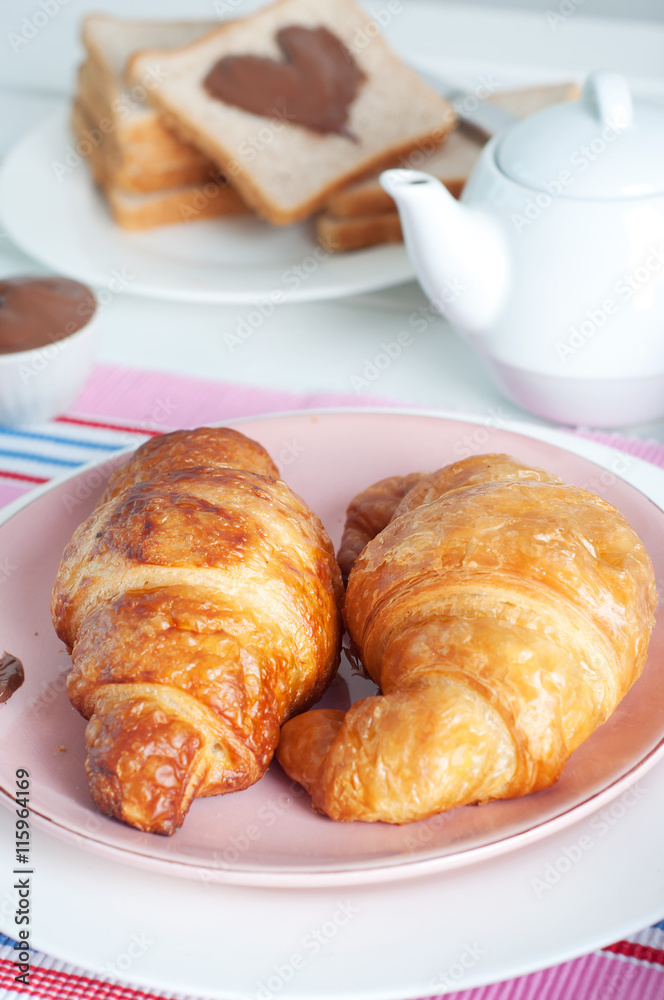 Sunday breakfast. Croissants with tea and peanut butter. Sunday breakfast. Croissants with tea and peanut butter.