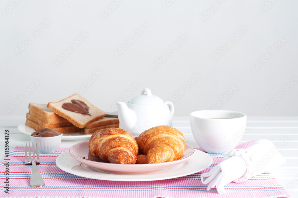 Sunday breakfast. Croissants with tea and peanut butter. Sunday breakfast. Croissants with tea and peanut butter.