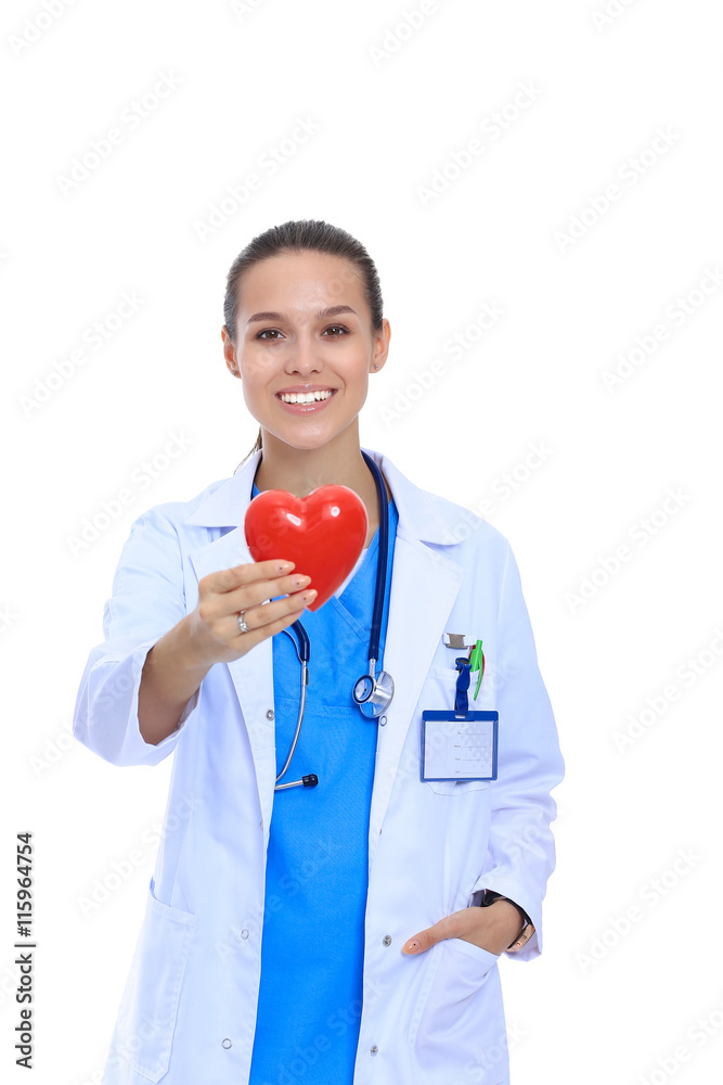Positive female doctor standing with stethoscope and red heart symbol isolated - obrazy, fototapety, plakaty 