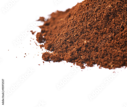 Pile of the ground coffee flakes isolated