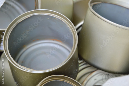 empty tin food can in sack bag