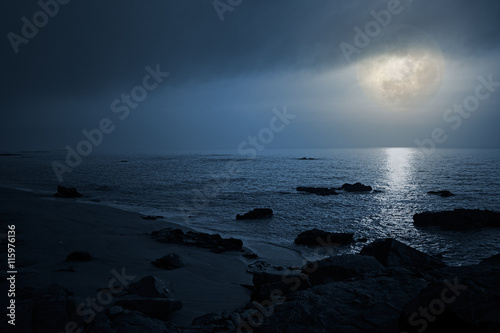 Empty seaside in a cloudy full moon night © Zacarias da Mata