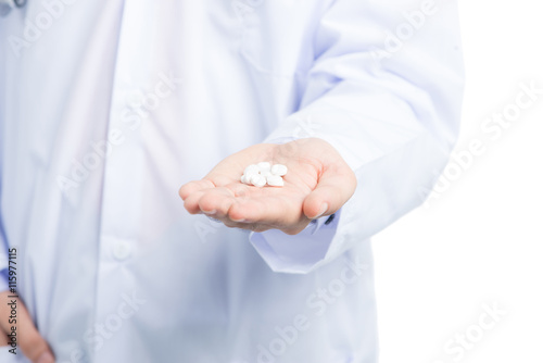 Male Doctor's Hand showing pills