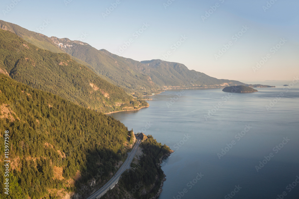Aerial view of Sea to Sky Hwy. Taken near Vancouver, British Columbia, Canada, on a hazy sunny sunset.