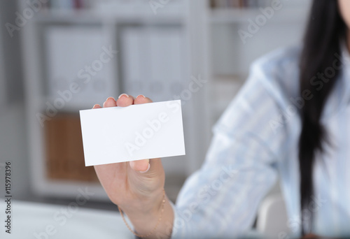 Close-up of business card in women hand