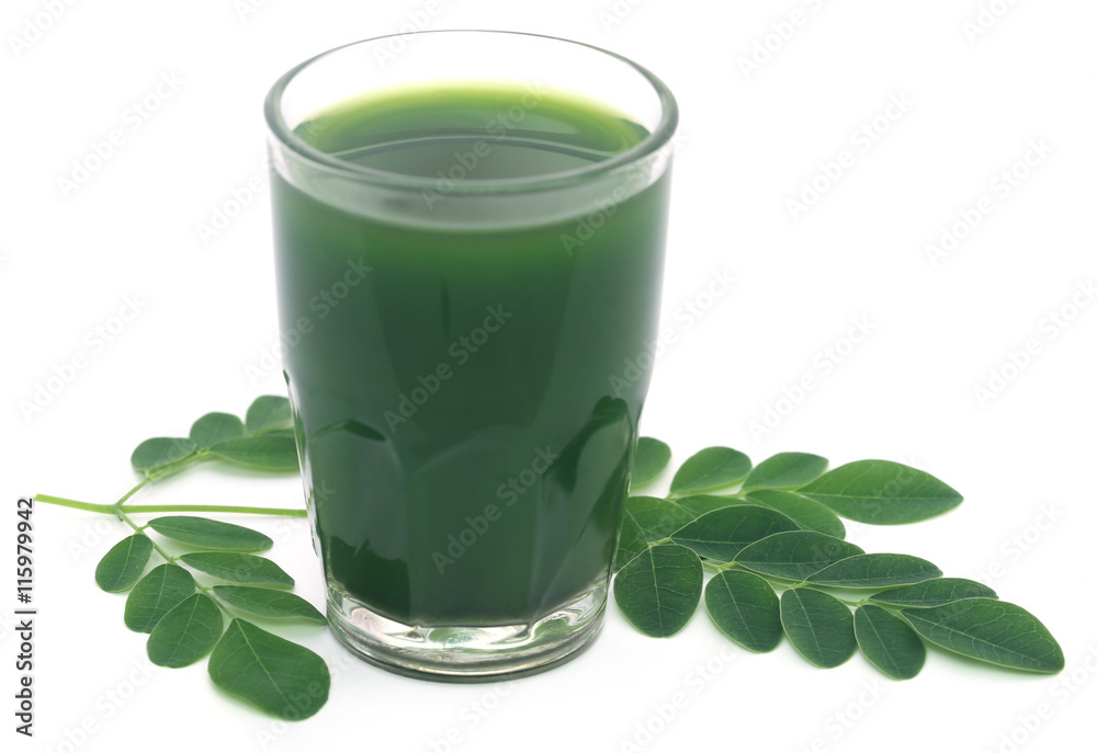Moringa leaves with extract in a glass Moringa leaves with extract in a glass