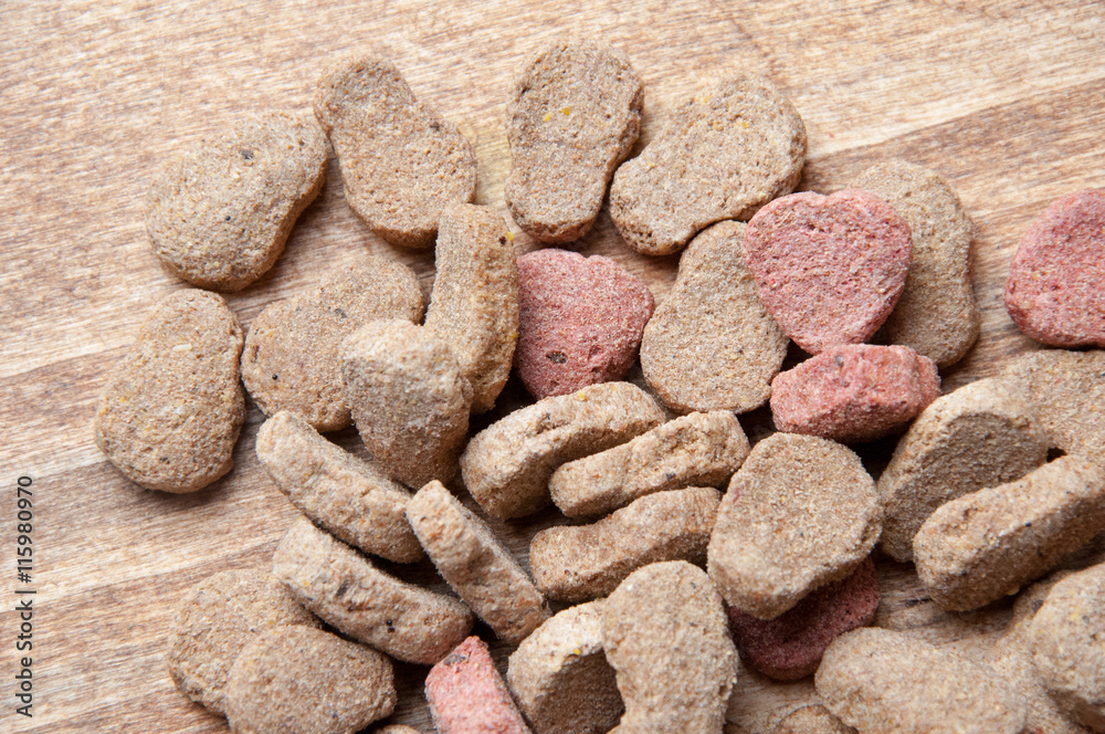 Fototapeta premium The image of dog food on a wooden table