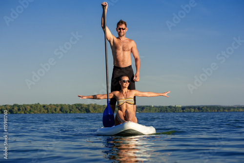 beach fun couple on stand up paddle board SUP04