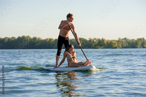 beach fun couple on stand up paddle board SUP02