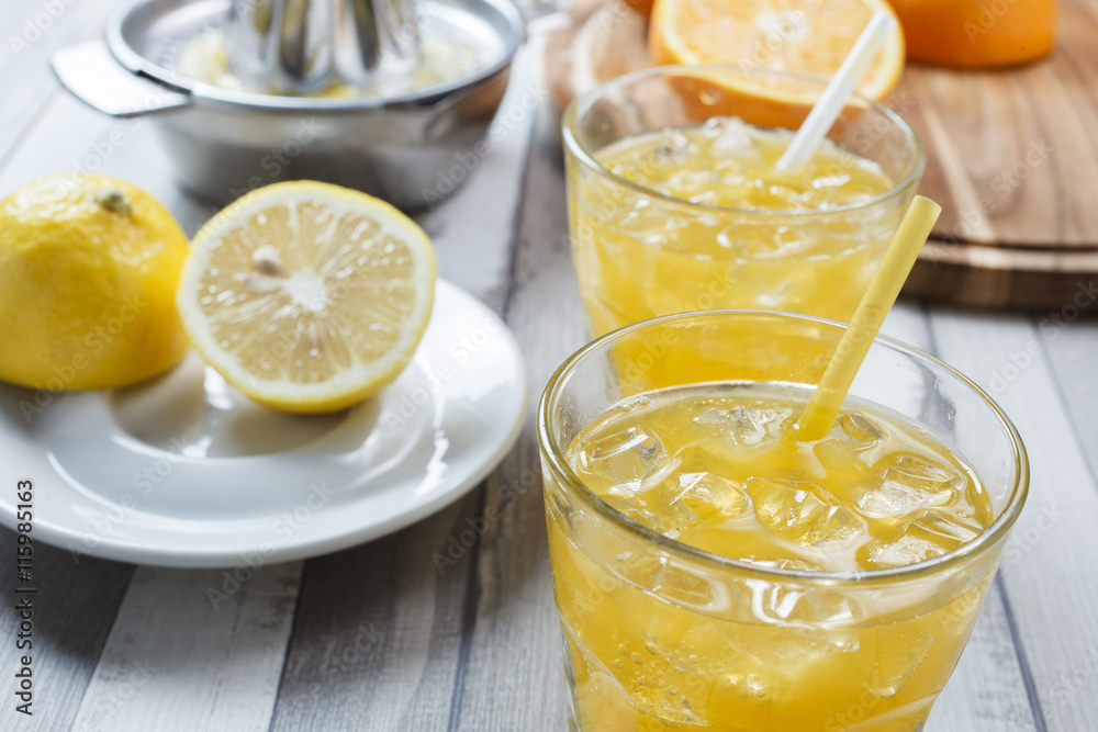 The cooled drink with fresh lemon and orange The cooled drink with fresh lemon and orange
