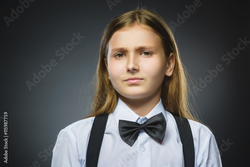 Offense girl isolated on gray background. Negative emotion. Closeup