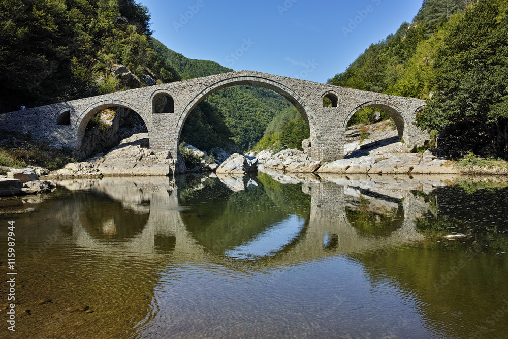 Amazing Reflection of The Devil's Bridge in Arda river and Rhodopes mountain, Kardzhali Region, Bulgaria