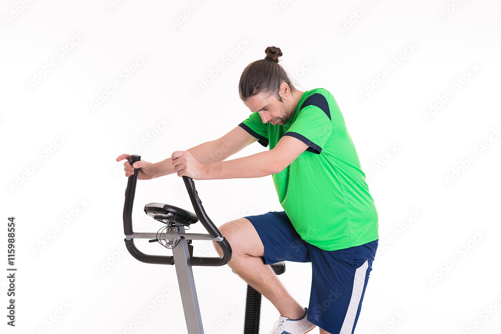 young man train with fitness machine young man train with fitness machine