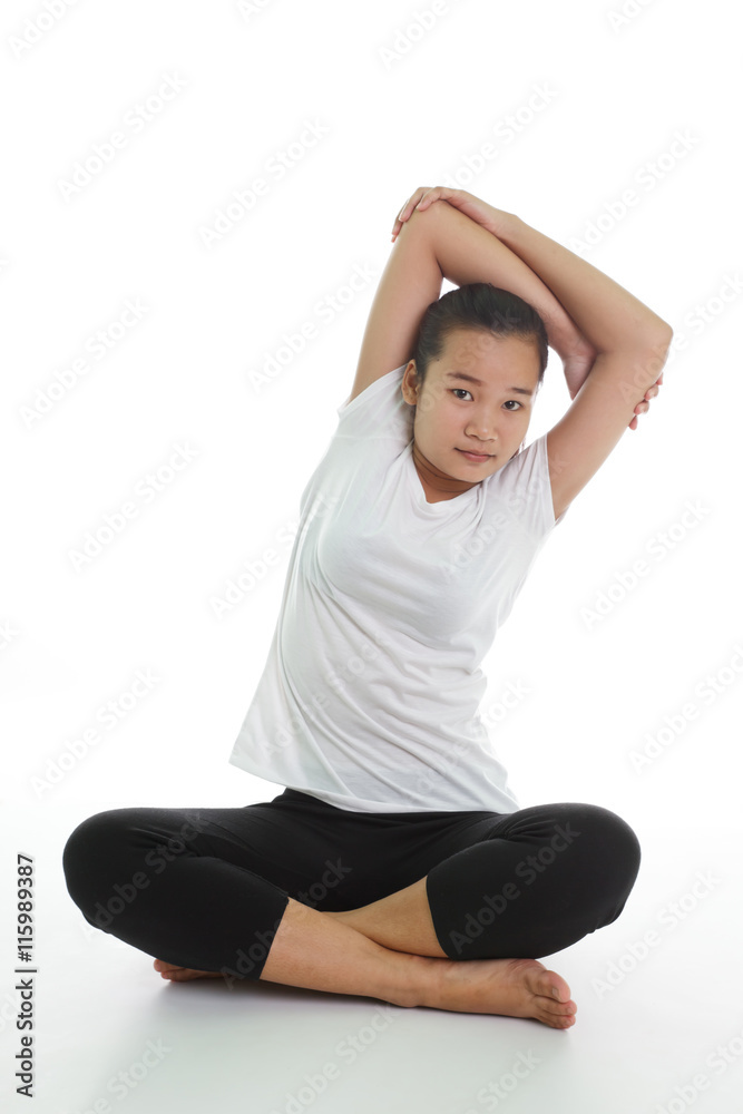 Portrait of young woman meditating in pose 