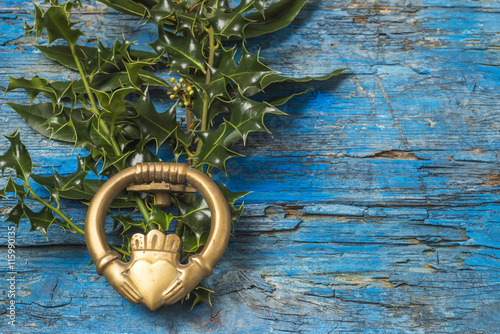 Claddagh and holly branches irish symbol of love