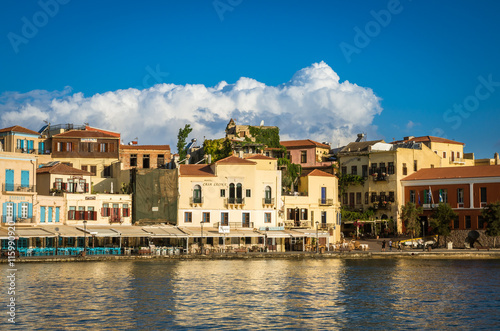 View of the old venetian port of Chania on Crete island  Greece. Tourists relaxing on promenade.