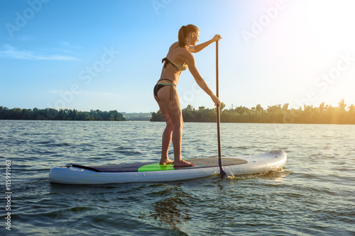 SUP Stand up paddle board woman paddle boarding12 photo