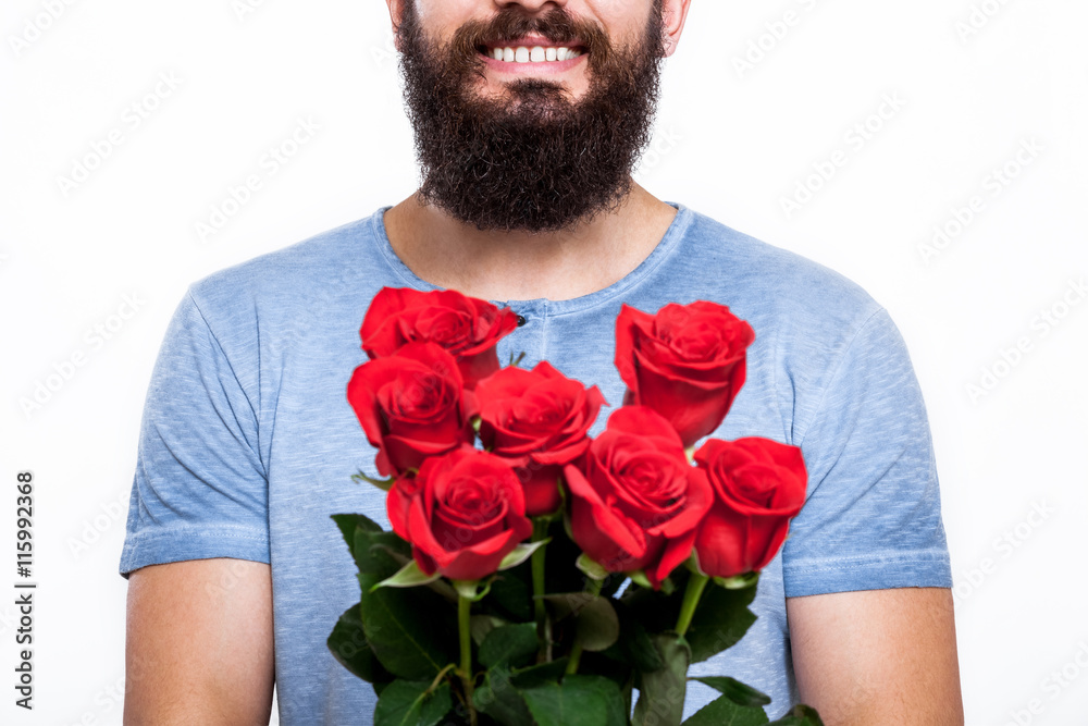 It's just for you! Unrecognizable man with beard holding bouquet of roses isolated on white background. It's just for you! Unrecognizable man with beard holding bouquet of roses isolated on white background.