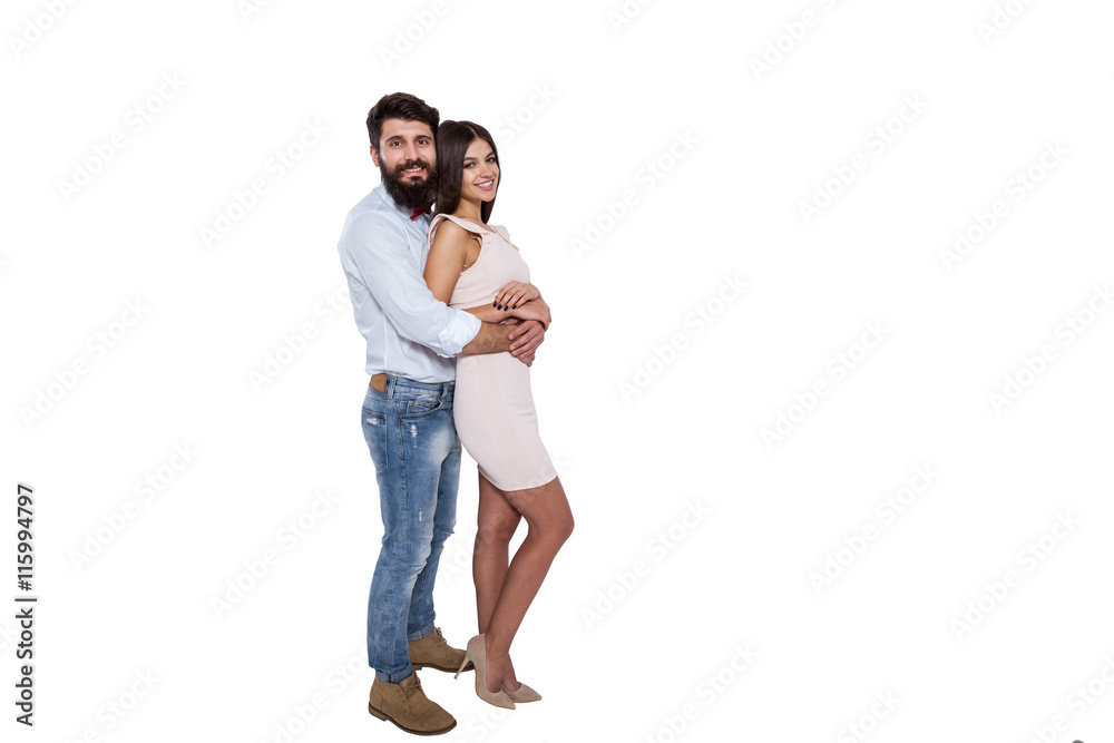 Happy to be together. Beautiful young couple standing close to each other and smiling at camera while isolated on white. Happy to be together. Beautiful young couple standing close to each other and smiling at camera while isolated on white.