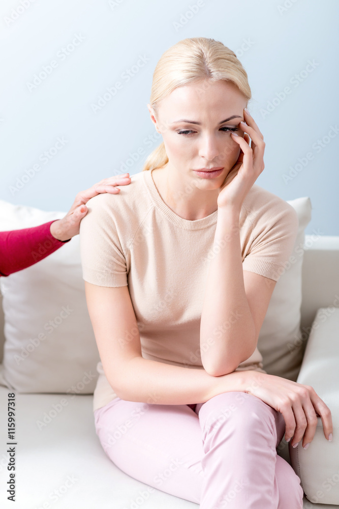Blond girl sharing her problems with parent