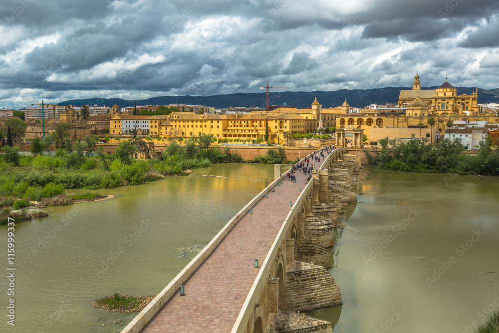 Aerial view to the Roman Bridge, Unesco Heritage, on the Guadalquivir river, seen from the Calahorra Tower in Cordoba, Andalusia, Spain.
