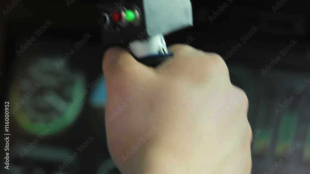 Pilot of military fighter pushing launch button on control stick, war attack Pilot of military fighter pushing launch button on control stick, war attack