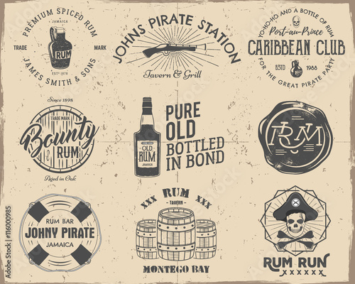 Set of vintage handcrafted pirates emblems, labels, logos. Isolated on a scratched paper background. Sketching filled style. Pirate and sea symbols - old rum bottles, barrels, skull, pistol. Vector