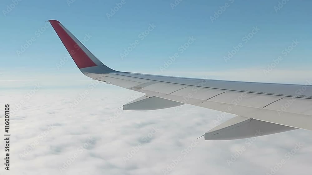 Wing of airplane from window Wing of airplane from window