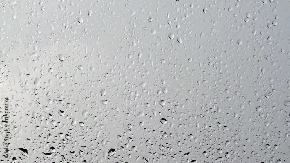 Raindrop on glass window pane