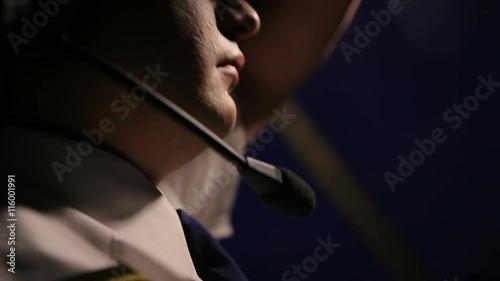 Male pilot operating plane at night, something's wrong, moment before accident