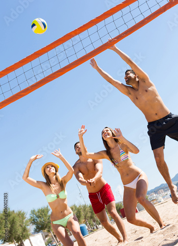 friends playing volleyball