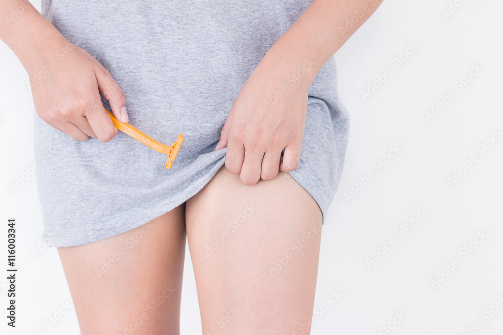Young woman shaves her crotch with a razor. Shaving crotch Stock Photo